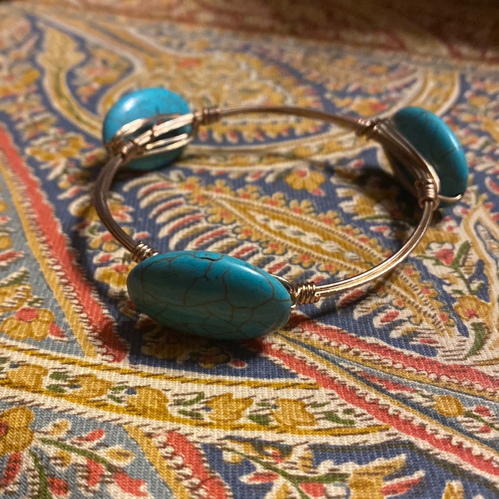 Goldtone and turquoise bangle bracelet.